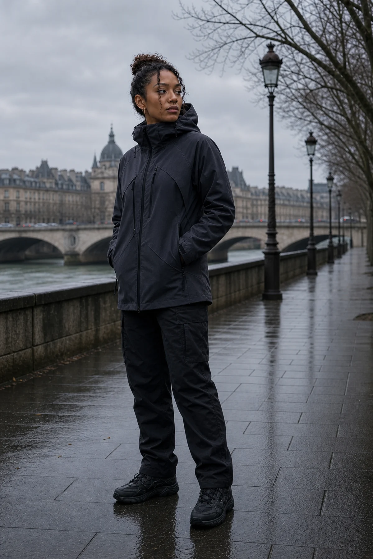 Editorial Paris riverside styling image showing a model wearing the Clothixpack CXP-J109 Vapor Hardshell Jacket.