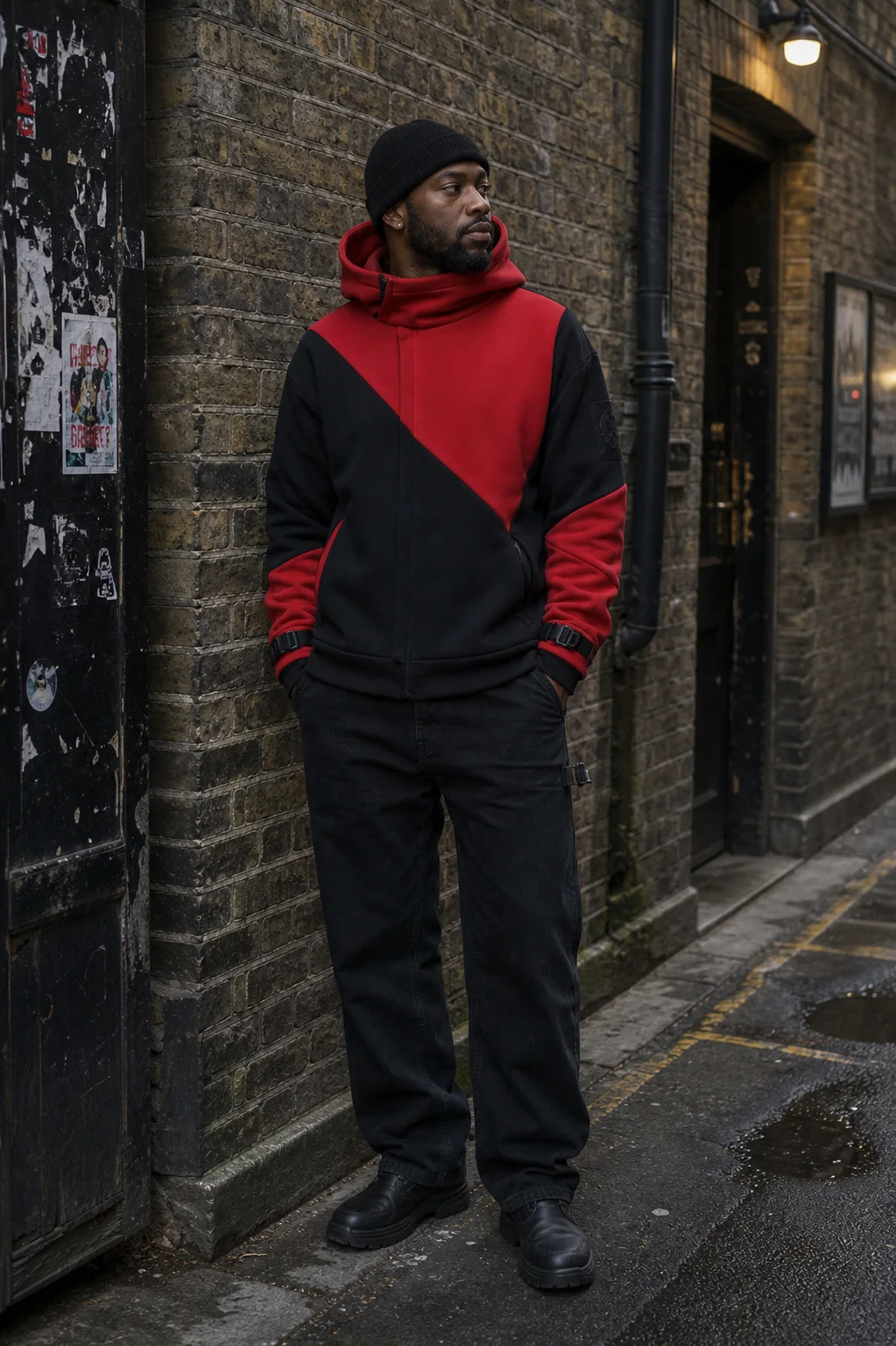 London brick alley styling image showing the Clothixpack CXP-H104 Cowl Technical Hoodie with black technical denim.