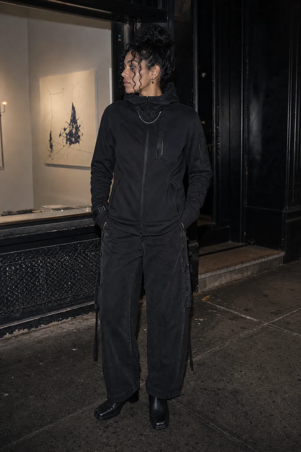 New York sidewalk flash styling image showing the Clothixpack CXP-H106 Veer Technical Hoodie with washed black wide-leg jeans.