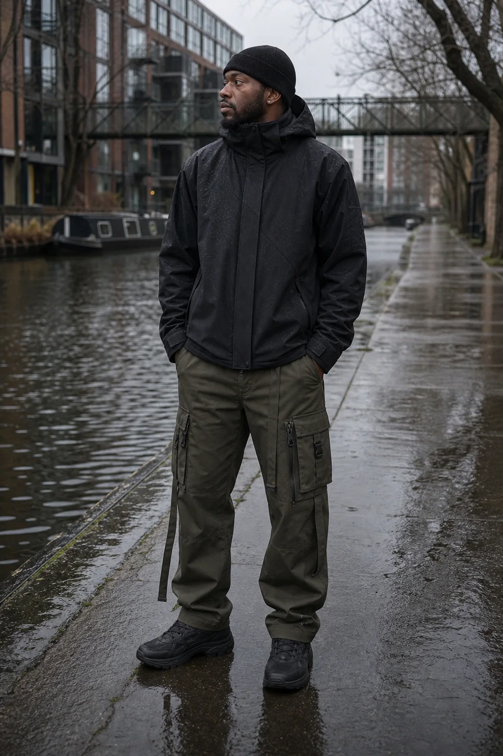 London canal towpath styling image showing the Clothixpack CXP-J103 Hush Hardshell Jacket with olive cargo pants.